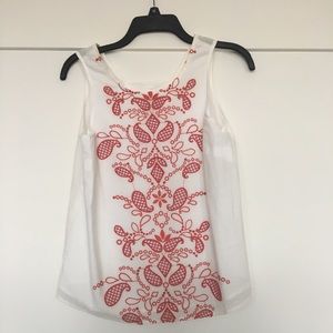 White top with red details